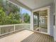 View from wood deck showcasing indoor/outdoor living with sliding glass doors overlooking a backyard at 625 Kendall Way, Lakewood, CO 80214