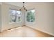 Bright dining area with large windows and modern lighting, perfect for Gathering meals at 625 Kendall Way, Lakewood, CO 80214