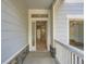 A well lit, open entryway showing wood floors and easy access to the garage at 625 Kendall Way, Lakewood, CO 80214