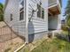 Angle view of home exterior shows landscaping and architectural features at 625 Kendall Way, Lakewood, CO 80214