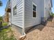 Exterior view showing the home's foundation and well-maintained siding at 625 Kendall Way, Lakewood, CO 80214