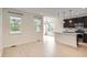 Bright kitchen with dark cabinetry, stainless steel appliances, granite countertops, and hardwood floors at 625 Kendall Way, Lakewood, CO 80214