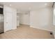 Open living room with recessed lighting, hardwood floors, and access to kitchen at 625 Kendall Way, Lakewood, CO 80214