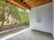 Charming covered patio with exposed wood beams and view of the backyard landscaping at 625 Kendall Way, Lakewood, CO 80214