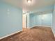 Finished basement with plush carpeting, recessed lighting, and freshly painted blue walls at 12025 Monaco Dr, Brighton, CO 80602