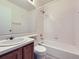 A bathroom featuring a toilet, sink with vanity, shower, and mirror at 12025 Monaco Dr, Brighton, CO 80602
