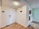 Inviting entryway with wood floors and a view into the kitchen at 12025 Monaco Dr, Brighton, CO 80602