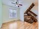 Bright living room with wood floors and staircase at 12025 Monaco Dr, Brighton, CO 80602