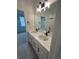 Elegant bathroom with double vanity, marble countertops, and sleek black fixtures at 203 Washington St, Erie, CO 80516