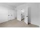 Spacious bedroom with a view into the bathroom and closet at 203 Washington St, Erie, CO 80516
