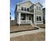 Charming two-story home with a welcoming front porch and well-lit windows at 203 Washington St, Erie, CO 80516