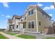 A lovely two-story home boasting a cozy front porch and a well-kept lawn in a peaceful neighborhood setting at 203 Washington St, Erie, CO 80516