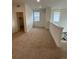 Cozy loft area with neutral carpet, bright windows, and ample natural light at 203 Washington St, Erie, CO 80516