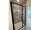 Stylish shower with a modern glass door and decorative tile work at 203 Washington St, Erie, CO 80516
