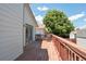 Back deck of home featuring wood floor, views of the neighborhood and house siding at 2800 Troxell Ave, Longmont, CO 80503