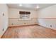 Basement featuring wood floors, one small window and white walls with brown trim at 2800 Troxell Ave, Longmont, CO 80503