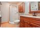 Bathroom featuring a stand up shower, wood cabinets and tan counters at 2800 Troxell Ave, Longmont, CO 80503