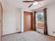 Bedroom with neutral carpet, closet, window view of trees and floral curtains at 2800 Troxell Ave, Longmont, CO 80503