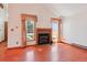 Bright living room featuring a fireplace, vaulted ceilings and wood floors with natural lighting at 2800 Troxell Ave, Longmont, CO 80503