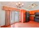 Open kitchen with stainless steel appliances, wood cabinets, and wood floors in the home at 2800 Troxell Ave, Longmont, CO 80503
