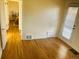 Hardwood floor bedroom with access to hallway and backyard at 799 N Holly St, Denver, CO 80220