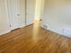 Bedroom with hardwood floors and multiple closets at 799 N Holly St, Denver, CO 80220