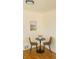 A cozy dining area features wood floors, table with chairs, and a bright window view at 799 N Holly St, Denver, CO 80220