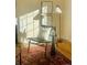 Bright room shows a chair with pillows next to a fireplace and bright natural light at 799 N Holly St, Denver, CO 80220