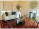 Living room with a white couch, fireplace, and rug at 799 N Holly St, Denver, CO 80220