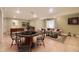 Finished basement features a pool table, poker table, and cozy seating area at 9742 E Hawaii Pl, Aurora, CO 80247