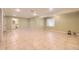 Spacious finished basement with neutral walls and ceramic tile flooring at 9742 E Hawaii Pl, Aurora, CO 80247