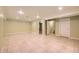 Basement features neutral walls, ceramic tile floors, and staircase at 9742 E Hawaii Pl, Aurora, CO 80247