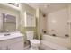 Bathroom featuring a combined shower and tub, accompanied by vanity with a sink at 9742 E Hawaii Pl, Aurora, CO 80247