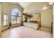 Open dining area with a large window, chandelier, and bar seating provide an ideal setting for gatherings at 9742 E Hawaii Pl, Aurora, CO 80247