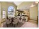 Elegant dining area with large windows and modern bar seating create an open and inviting space for entertaining at 9742 E Hawaii Pl, Aurora, CO 80247
