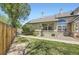 Charming home with well-maintained lawn, brick accents, and a cozy porch at 9742 E Hawaii Pl, Aurora, CO 80247