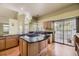 Spacious kitchen with island cooktop, granite countertops, hardwood floors and an open layout perfect for entertaining at 9742 E Hawaii Pl, Aurora, CO 80247