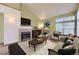 Inviting living room with fireplace, vaulted ceiling and stylish furniture creates a cozy and elegant atmosphere at 9742 E Hawaii Pl, Aurora, CO 80247