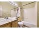 Bathroom features a double vanity and a shower/tub combo with tiled walls at 9742 E Hawaii Pl, Aurora, CO 80247