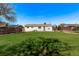 Large, open backyard featuring green grass and partial shade at 9120 Judson St, Westminster, CO 80031