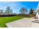 Wide backyard featuring a concrete patio and mature trees, perfect for outdoor enjoyment at 9120 Judson St, Westminster, CO 80031