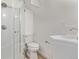 Modern bathroom featuring shower with glass door, white sink and toilet at 9120 Judson St, Westminster, CO 80031