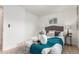 Bedroom features a cushioned bench, two side tables and new floors at 9120 Judson St, Westminster, CO 80031