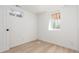 This bright bedroom features two windows and wood flooring at 9120 Judson St, Westminster, CO 80031