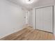 This bedroom features light wood floors, closet and access to the bathroom at 9120 Judson St, Westminster, CO 80031