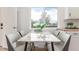 Inviting breakfast nook with a marble table, comfortable seating, and a view of the outdoors, creating a cozy atmosphere at 9120 Judson St, Westminster, CO 80031