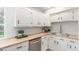 Bright kitchen features white cabinets, stainless steel appliances, and butcher block countertops at 9120 Judson St, Westminster, CO 80031