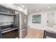 Open-concept kitchen with stainless steel appliances and plenty of counter space at 9120 Judson St, Westminster, CO 80031