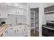 Kitchen features white cabinets and a pantry for lots of storage at 9120 Judson St, Westminster, CO 80031