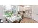 Bright kitchen with butcher block-style countertops, stainless steel appliances, and a cozy dining area at 9120 Judson St, Westminster, CO 80031